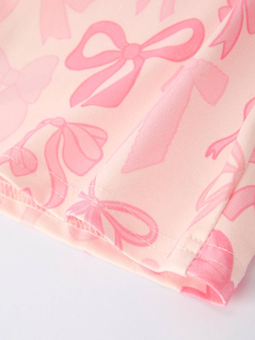 Girls Pink Bow Print Long Sleeve Jumpsuit