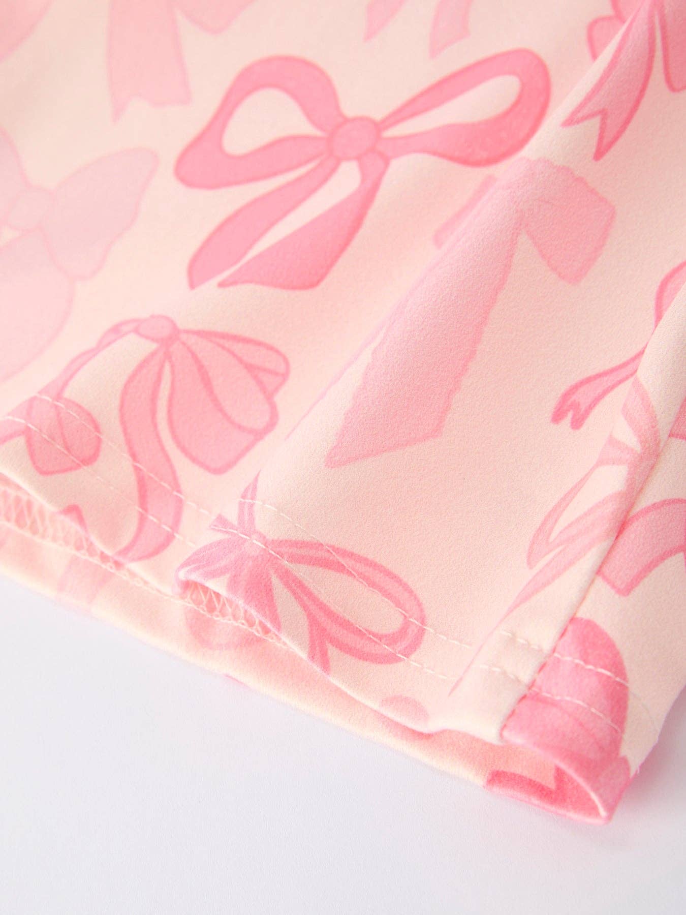 Girls Pink Bow Print Long Sleeve Jumpsuit