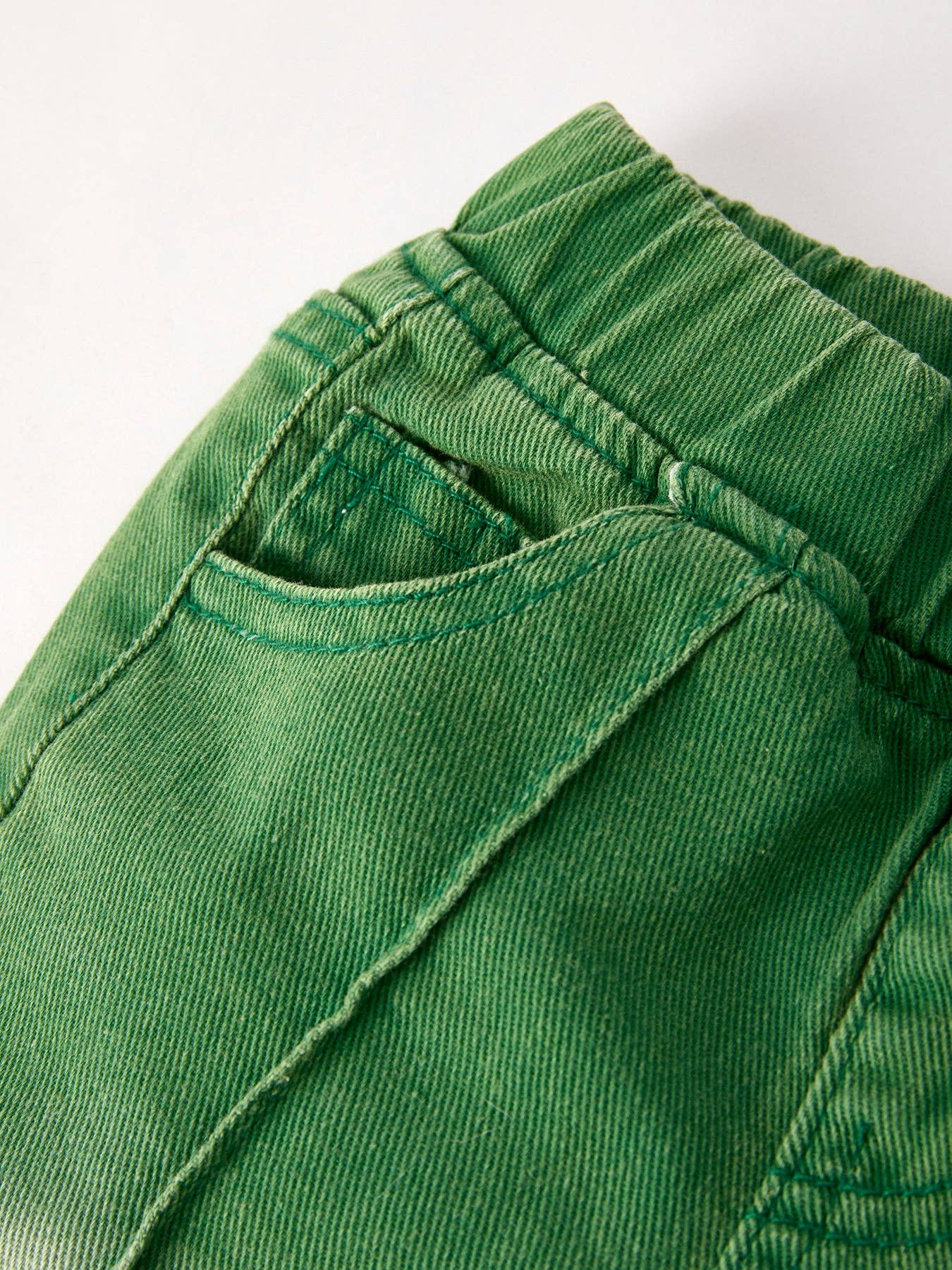 Green Flared Elastic Jeans